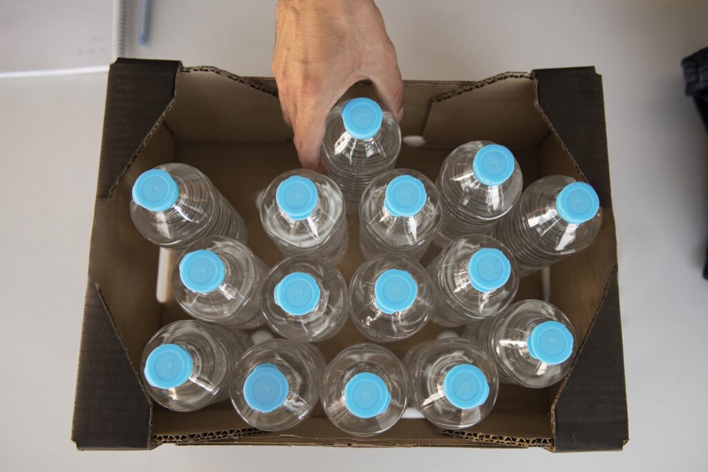 close-up-volunteer-oganizing-stuff-donation