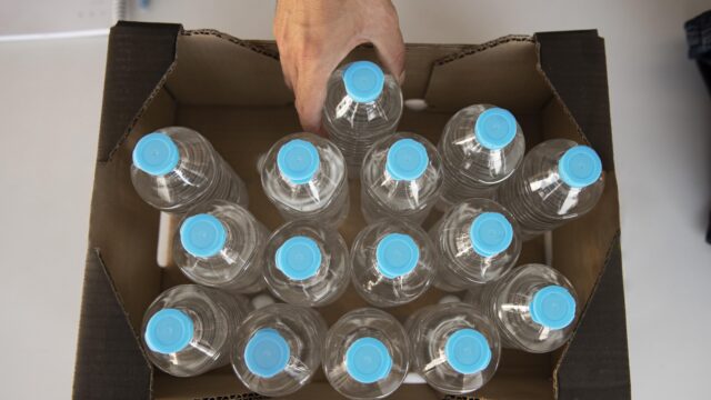 close-up-volunteer-oganizing-stuff-donation